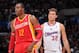 LOS ANGELES, CA - NOVEMBER 4: Dwight Howard #12 of the Houston Rockets looks on with Blake Griffin #32 of the Los Angeles Clippers at Staples Center on November 4, 2013 in Los Angeles, California. NOTE TO USER: User expressly acknowledges and agrees that,