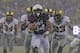 PHILADELPHIA - DECEMBER 14: Noah Copeland #34 of the Navy Midshipmen runs for a touchdown in the second quarter during a game against the Army Black Knights on December 14, 2013 at Lincoln Financial Field in Philadelphia, Pennsylvania.(Photo by Hunter Mar