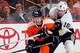PHILADELPHIA, PA - DECEMBER 08: James Neal #18 of the Pittsburgh Penguins checks Claude Giroux #28 of the Philadelphia Flyers in an NHL hockey game at Wells Fargo Center on December 8, 2011 in Philadelphia, Pennsylvania. (Photo by Paul Bereswill/Getty I