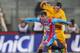 CATANIA, ITALY - DECEMBER 14: Gino Peruzzi (L) of Catania competes for the ball with Juan Gomez of Hellas Verona during the Serie A match between Calcio Catania and Hellas Verona at Stadio Angelo Massimino on December 14, 2013 in Catania, Italy. (Photo