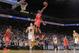 OAKLAND, CA - DECEMBER 13: James Harden #13 of the Houston Rockets dunks against David Lee #10 of the Golden State Warriors on December 13, 2013 at Oracle Arena in Oakland, California. NOTE TO USER: User expressly acknowledges and agrees that, by download