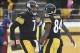 Dec 8, 2013; Pittsburgh, PA, USA; Pittsburgh Steelers quarterback Ben Roethlisberger (7) celebrates a touchdown with wide receiver Antonio Brown (84) against the Miami Dolphins during the second half at Heinz Field. The Dolphins won the game, 34-27. Manda