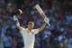 PERTH, AUSTRALIA - DECEMBER 15: David Warner of Australia raises his bat after he scored his century during day three of the Third Ashes Test Match between Australia and England at WACA on December 15, 2013 in Perth, Australia. (Photo by Robert Cianflon