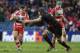 EDINBURGH, SCOTLAND - DECEMBER 08: Grant Gilchrist of Edinburgh tackles Freddie Burns of Gloucester during the The Heineken Cup Pool 6 Match between Edinburgh and Gloucester at Murrayfield Stadium, on December 08, 2013 in Edinburgh, Scotland. (Photo by I