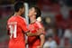 LISBON, PORTUGAL - SEPTEMBER 17: Filip Djuricic of SL Benfica celebrates scoring the opening goal of the match with team-mate Andre Almeida during the UEFA Champions League group stage match between SL Benfica and RSC Anderlecht held on September 17, 201