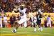 Nov 30, 2013; Tempe, AZ, USA; Arizona Wildcats running back Ka'Deem Carey (25) scores a touchdown in the second half against the Arizona State Sun Devils in the 87th annual Territorial Cup at Sun Devil Stadium. Arizona State defeated Arizona 58-21. Mandat