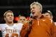 ARLINGTON, TX - DECEMBER 5: Head coach Mack Brown of the Texas Longhorns celebrates speaks to the crowd with quarterback Colt McCoy #12 after their team won the game 10-6 over the Nebraska Cornhuskers at Cowboys Stadium on December 5, 2009 in Arlington, T