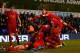 LONDON, ENGLAND - DECEMBER 15: Jon Flanagan of Liverpool is mobbed by his team mates after scoring their third goal during the Barclays Premier League match between Tottenham Hotspur and Liverpool at White Hart Lane on December 15, 2013 in London, Englan