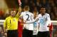 LONDON, ENGLAND - DECEMBER 15: Referee Jonathan Moss shows Paulinho of Tottenham Hotspur a red card for a foul on Luis Suarez of Liverpool during the Barclays Premier League match between Tottenham Hotspur and Liverpool at White Hart Lane on December 15,