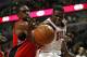 CHICAGO, IL - DECEMBER 14: Patrick Patterson #54 of the Toronto Raptors knocks the ball away from Loul Deng #9 of the Chicago Bulls at the United Center on December 14, 2013 in Chicago, Illinois. The Raptors defeated the Bulls 99-77. NOTE TO USER: User ex