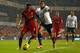 LONDON, ENGLAND - DECEMBER 15: Raheem Sterling of Liverpool and Ezekiel Fryers of Tottenham Hotspur compete for the ball during the Barclays Premier League match between Tottenham Hotspur and Liverpool at White Hart Lane on December 15, 2013 in London, En