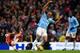MANCHESTER, ENGLAND - DECEMBER 14: Vincent Kompany of Manchester City shakes off Mathieu Flamini of Arsenal during the Barclays Premier League match between Manchester City and Arsenal at Etihad Stadium on December 14, 2013 in Manchester, England. (Phot