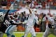 Dec 15, 2013; Miami Gardens, FL, USA: Miami Dolphins quarterback Ryan Tannehill (17) throws a pass as New England Patriots defensive end Chandler Jones (95) applies pressure in the second quarter at Sun Life Stadium. Mandatory Credit: Robert Mayer-USA TOD