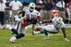 Dec 15, 2013; Miami Gardens, FL, USA; New England Patriots wide receiver Julian Edelman (11) catches a pass in front of Miami Dolphins free safety Reshad Jones (20) and defensive end Cameron Wake (91) in the first quarter at Sun Life Stadium. Mandatory Cr
