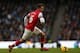 MANCHESTER, ENGLAND - DECEMBER 14: Aaron Ramsey of Arsenal in action during the Barclays Premier League match between Manchester City and Arsenal at Etihad Stadium on December 14, 2013 in Manchester, England. (Photo by Clive Brunskill/Getty Images)