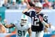 Dec 15, 2013; Miami Gardens, FL, USA; New England Patriots quarterback Tom Brady (12) is pressured by Miami Dolphins defensive end Cameron Wake (91) during the first half at Sun Life Stadium. Mandatory Credit: Steve Mitchell-USA TODAY Sports