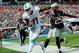 Dec 15, 2013; Miami Gardens, FL, USA; New England Patriots cornerback Kyle Arrington (25) pushes Miami Dolphins wide receiver Mike Wallace (11) out of bounce during the first half at Sun Life Stadium. Mandatory Credit: Steve Mitchell-USA TODAY Sports