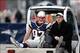 Dec 8, 2013; Foxborough, MA, USA; New England Patriots tight end Rob Gronkowski (87), accompanied by Dr. Thomas Gill, is carted off the field after being injured during the third quarter of New England's 27-26 win over the Cleveland Browns at Gillette Sta