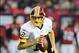 Dec 15, 2013; Atlanta, GA, USA; Washington Redskins quarterback Kirk Cousins (12) rolls out against the Atlanta Falcons during the second quarter at the Georgia Dome. Mandatory Credit: Dale Zanine-USA TODAY Sports