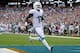 Dec 15, 2013; Miami Gardens, FL, USA; Miami Dolphins wide receiver Mike Wallace (11) scores a touchdown against the New England Patriots in the first half of the game at Sun Life Stadium. Mandatory Credit: Brad Barr-USA TODAY Sports
