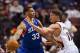 Dec 14, 2013; Philadelphia, PA, USA; Philadelphia 76ers center Daniel Orton (33) passes the ball under pressure from Portland Trail Blazers center Meyers Leonard (11) during the fourth quarter at the Wells Fargo Center. The Trail Blazers defeated the Sixe