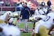 Nov 30, 2013; Stanford, CA, USA; Notre Dame Fighting Irish head coach Brian Kelly walks amongst players before the game against the Stanford Cardinal at Stanford Stadium. Mandatory Credit: Kelley L Cox-USA TODAY Sports