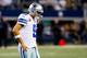 ARLINGTON, TX - DECEMBER 15: Quarterback Tony Romo #9 of the Dallas Cowboys walks off the field after losing 37-36 to the Green Bay Packers during a game at AT&T Stadium on December 15, 2013 in Arlington, Texas. (Photo by Tom Pennington/Getty Images)