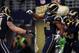 ST. LOUIS, MO - NOVEMBER 24: Robert Quinn #94 of the St. Louis Rams celebrates a fourth quarter touchdown against the Chicago Bears with teamates at the Edward Jones Dome on November 24, 2013 in St. Louis, Missouri. (Photo by Michael Thomas/Getty Images)