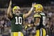 Dec 15, 2013; Arlington, TX, USA; Green Bay Packers quarterback Matt Flynn (10) reacts to a touchdown with tight end Andrew Quarless (81) in the fourth quarter at AT&T Stadium. Packers beat the Cowboys 37-36. Mandatory Credit: Tim Heitman-USA TODAY Spor