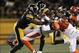 Dec 15, 2013; Pittsburgh, PA, USA; Pittsburgh Steelers linebacker Terence Garvin (57) tackles Cincinnati Bengals punter Kevin Huber (10) during the first quarter at Heinz Field. Mandatory Credit: Jason Bridge-USA TODAY Sports