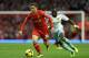 LIVERPOOL, ENGLAND - DECEMBER 07: Joe Allen of Liverpool competes with Mohamed Diame of West Ham United during the Barclays Premier League match between Liverpool and West Ham United at Anfield on December 7, 2013 in Liverpool, England. (Photo by Clive