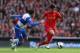 LIVERPOOL, ENGLAND - OCTOBER 20: Jem Karacan of Reading competes with Suso of Liverpool during the Barclays Premier League match between Liverpool and Reading at Anfield on October 20, 2012 in Liverpool, England. (Photo by Clive Brunskill/Getty Images)