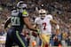 SEATTLE, WA - SEPTEMBER 15: Quarterback Colin Kaepernick #7 of the San Francisco 49ers rushes against outside linebacker K.J. Wright #50 of the Seattle Seahawks at CenturyLink Field on September 15, 2013 in Seattle, Washington. (Photo by Otto Greule Jr/