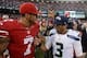 December 8, 2013; San Francisco, CA, USA; San Francisco 49ers quarterback Colin Kaepernick (7) shakes hands with Seattle Seahawks quarterback Russell Wilson (3) after the game at Candlestick Park. The 49ers defeated the Seahawks 19-17. Mandatory Credit: K