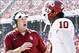 Oct 12, 2013; Dallas, TX, USA; Oklahoma Sooners head coach Bob Stoops talks to defensive back Quentin Hayes (10) after a play against the Texas Longhornsduring the Red River Rivalry at Cotton Bowl Stadium. Mandatory Credit: Tim Heitman-USA TODAY Sports