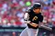 ST LOUIS, MO - OCTOBER 04: Justin Morneau #66 of the Pittsburgh Pirates hits a single in the third inning against the St. Louis Cardinals during Game Two of the National League Division Series at Busch Stadium on October 4, 2013 in St Louis, Missouri. (
