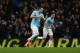 MANCHESTER, ENGLAND - DECEMBER 01: Alvaro Negredo (L) of Manchester City celebrates scoring the opening goal during the Barclays Premier League match between Manchester City and Swansea City at Etihad Stadium on December 1, 2013 in Manchester, England.