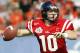 DALLAS - JANUARY 2: Quarterback Eli Manning #10 of the Mississippi Rebels looks for a receiver against the Oklahoma State Cowboys in the first quarter during the SBC Cotton Bowl January 2, 2004 at the Cotton Bowl in Dallas, Texas. Ole Miss won 31-28. (