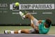 INDIAN WELLS, CA - MARCH 13: Rafael Nadal of Spain falls after losing his footing in his match with Ernests Gulbis of Latvia during day 8 of the BNP Paribas Open at Indian Wells Tennis Garden on March 13, 2013 in Indian Wells, California. (Photo by Step