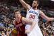 Jan 12, 2013; Philadelphia, PA, USA; Houston Rockets center Omer Asik (3) is defended by Philadelphia 76ers center Spencer Hawes (00) during the fourth quarter at the Wells Fargo Center. The Sixers defeated the Rockets 107-100. Mandatory Credit: Howard Sm