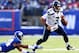 EAST RUTHERFORD, NJ - DECEMBER 15: Russell Wilson #3 of the Seattle Seahawks scrambles as Terrell Thomas #24 of the New York Giants misses the tackle at MetLife Stadium on December 15, 2013 in East Rutherford, New Jersey. (Photo by Elsa/Getty Images)
