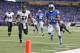DETROIT, MI - DECEMBER 16: Reggie Bush #21 of the Detroit Lions runs 14 yards for a touchdown during the first quarter of the game against the Baltimore Ravens at Ford Field on December 16, 2013 in Detroit, Michigan. (Photo by Leon Halip/Getty Images)