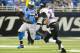 DETROIT, MI - DECEMBER 16: Running back Joique Bell #35 of the Detroit Lions runs for a gain while under pressure from cornerback Jimmy Smith #22 of the Baltimore Ravens during the first half at Ford Field on December 16, 2013 in Detroit, Michigan. (Photo