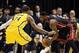 Dec 10, 2013; Indianapolis, IN, USA; Miami Heat guard LeBron James (6) is guarded by Indiana Pacers forward Paul George (24) at Bankers Life Fieldhouse. Indiana defeats Miami 90-84. Mandatory Credit: Brian Spurlock-USA TODAY Sports