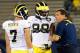 EAST HARTFORD, CT - SEPTEMBER 21: Brady Hoke, coach of the Michigan Wolverines, talks with Devin Gardner #98 and Shane Morris #7 before a game with the Connecticut Huskies at Rentschler Field on September 21, 2013 in East Hartford, Connecticut. (Photo