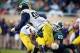 Nov 2, 2013; East Lansing, MI, USA; Michigan Wolverines quarterback Devin Gardner (98) is sacked by Michigan State Spartans defensive end Shilique Calhoun (89) during the 2nd half of a game at Spartan Stadium. MSU won 29-6. Mandatory Credit: Mike Carter-U