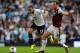LONDON, ENGLAND - OCTOBER 06: Andros Townsend of Tottenham (L) evades the tackle of West Ham captain Kevin Nolan during the Barclays Premier League match between Tottenham Hotspur and West Ham United at White Hart Lane on October 6, 2013 in London, Engla