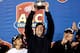CHARLOTTE, NC - DECEMBER 07: Head coach Jimbo Fisher of the Florida State Seminoles celebrates with the trophy after defeating the Duke Blue Devils 45-7 in the ACC Championship game at Bank of America Stadium on December 7, 2013 in Charlotte, North Carol