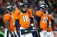 DENVER, CO - DECEMBER 12: Quarterback Peyton Manning #18 of the Denver Broncos is surrounded by teammates during a break in the action during a game against the San Diego Chargers at Sports Authority Field Field at Mile High on December 12, 2013 in Denve