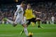 MADRID, SPAIN - OCTOBER 30: Gareth Bale (L) of Real Madrid CF competes for the ball with Alberto Moreno (R) of Sevilla FC during the La Liga match between Real Madrid CF and Sevilla FC at Estadio Santiago Bernabeu on October 30, 2013 in Madrid, Spain. (